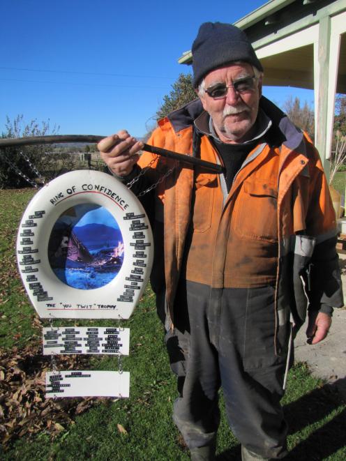 James Armstrong, of Lauder, holds their family's "You Twit'' trophy, given out annually among their family and friends for the opening day of duck-shooting season. Photo: Pam Jones