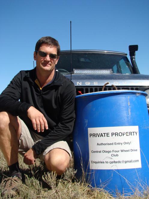 Central Otago 4WD Club treasurer Brent Wilson crouches at the entrance to the club’s grounds near...