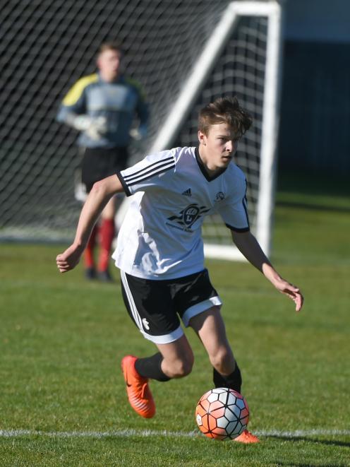 Shar Thorn, of Roslyn-Wakari, looks to pass in the Chatham Cup match against Invercargill Thistle at Ellis Park on Saturday. Photo: Gregor Richardson.