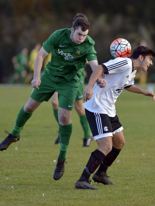 Green Island's Sam Dore (left) and Roslyn-Wakari's Tennessee Kinghorn compete for the ball at Sunnyvale on Saturday. Green Island won 2-1. Photo: Gerard O'Brien.