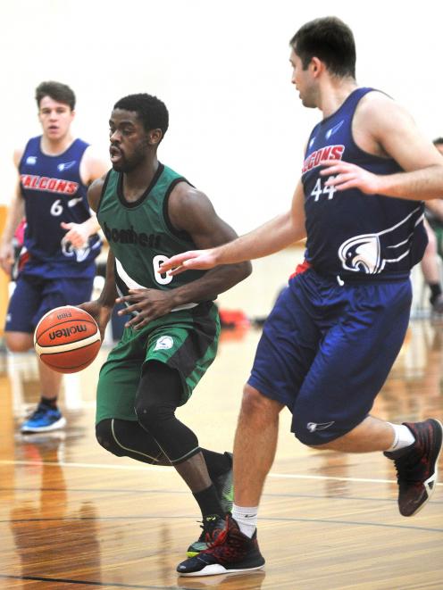 Henrie Njob-Anti runs the ball up court while Falcons players Sean Duff (left) and Matt Bazsika look to slow him down in a club match at the Edgar Centre on Saturday. Photo: Christine O'Connor.