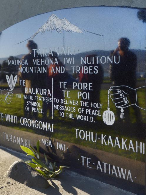 Participants gather for ‘prayers for peace’ at the Rongo Stone Memorial in Dunedin yesterday. The...