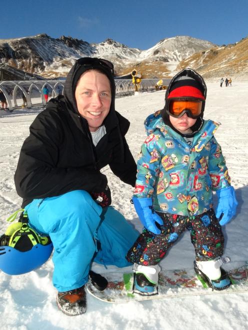 Nick and Austin (2) Troon, of Arrowtown, on  the learner slope as Austin tries snowboarding for...