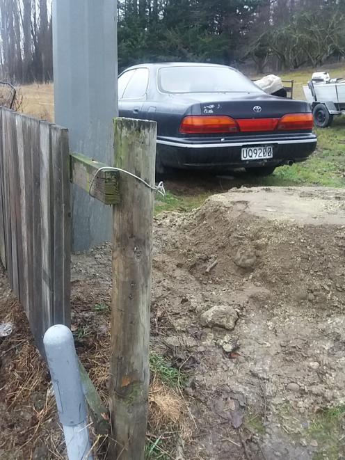 A 45cm-high pile of dirt is left behind after a power pole was replaced on Clive Cullen’s Letts...