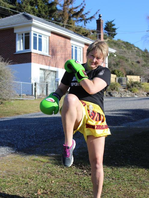 Muay Thai specialist Sue Glassey kicks and jabs outside her Roxburgh home. Photo: Jono Edwards