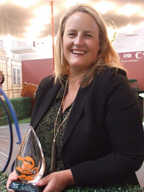 Design Federation director Annabel Berry stands by the carousel at Whitestone City with the...