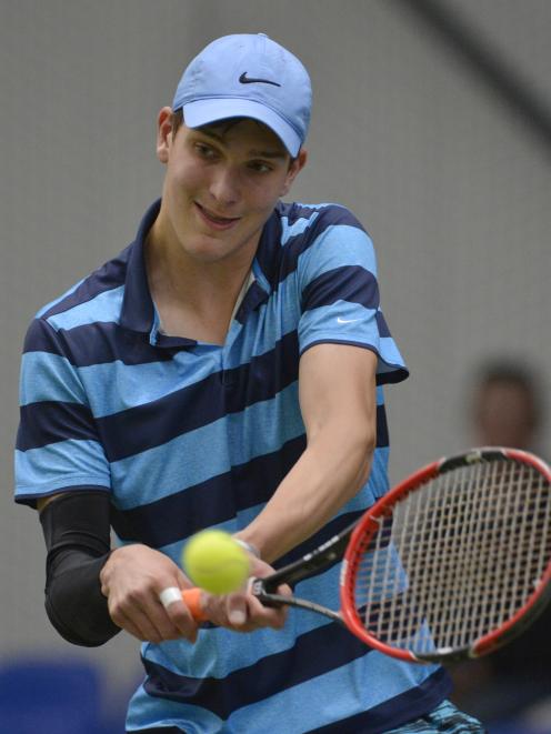 James Watt (17) plays a similar shot against Thomas Hartono during the men’s final.
