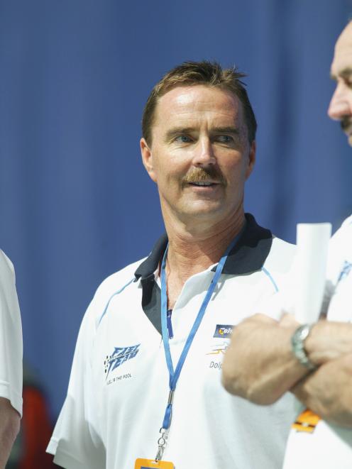 Former Australian Olympic swim coach Scott Volkers, pictured here in 2003, has been charged with...