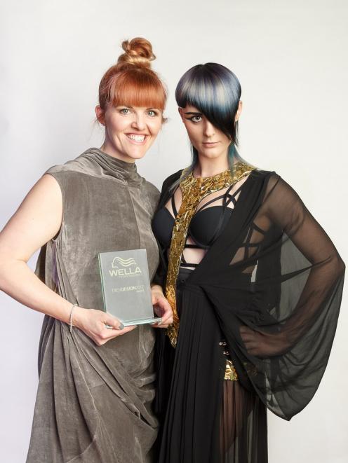 Kylie Hayes (left), of Moha Hairdressing in St Kilda, with her model wearing the hairstyle which won Mrs Hayes the creative vision platinum award at International TrendVision 2017. Photo: Supplied