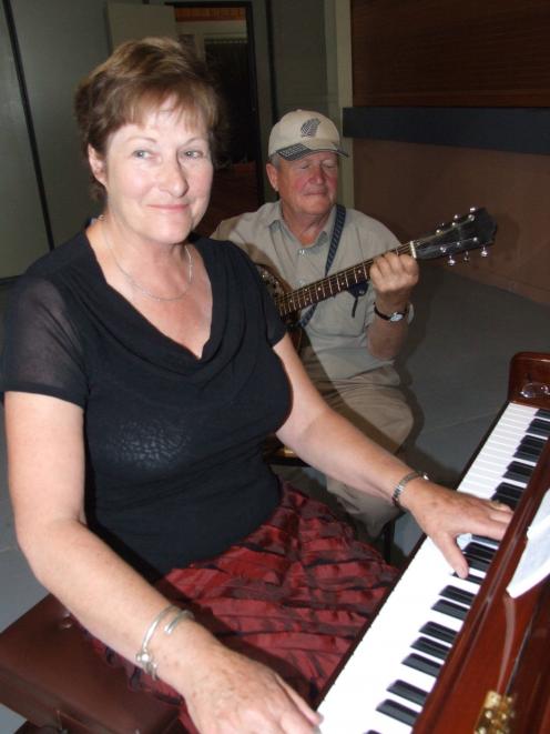 The late June Flint and her husband Archie entertain at the Athenaeum Hall in Arrowtown in 2009. Photo: ODT files
