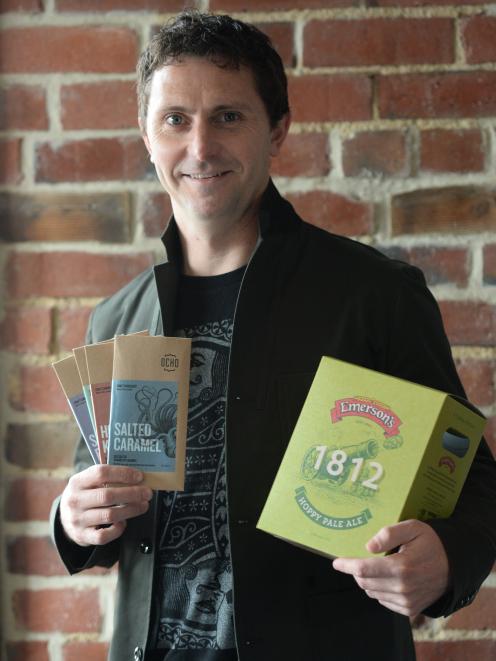 BrandAid owner Luke Johnston with two of the products he has won packaging awards for. PHOTO:...