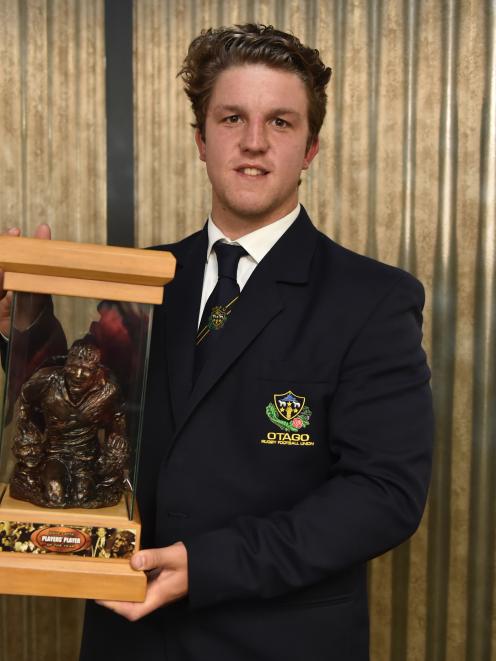 Otago second five eighth Tei Walden holds the David Latta Trophy after being presented with it at the Otago rugby awards ceremony at the Mornington Tavern last night. Photo: Gregor Richardson