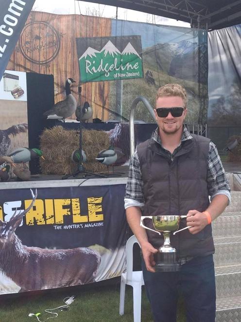 Luggate builder Hunter Morrow with the New Zealand Duck Calling Championship trophy he won in...