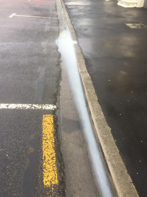 Road-marking paint runs into the gutter. PHOTO: ROBBIEBAXTER
