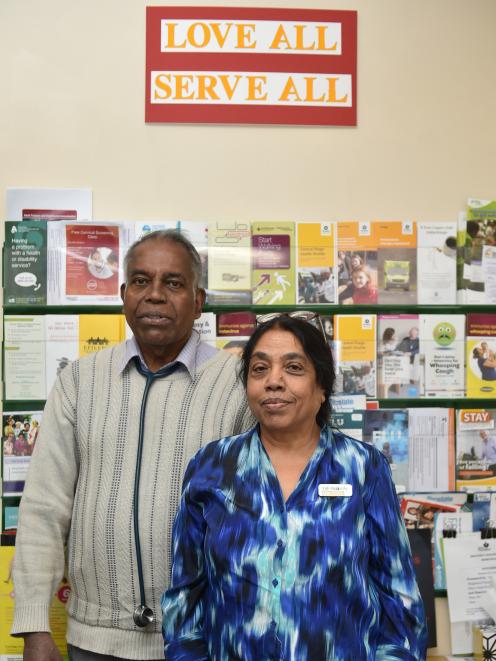 Dr Rama T Ragupathy and his wife Villi in Dunedin yesterday underneath their motto: "Love All...