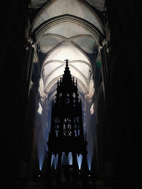 Durham Cathedral’s vaulted ceiling  is illuminated by a light installation. Photo: Reuters