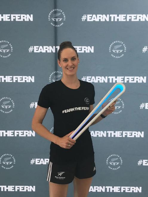 Carina Doyle with the Commonwealth Games baton at the announcement of the New Zealand swimming...