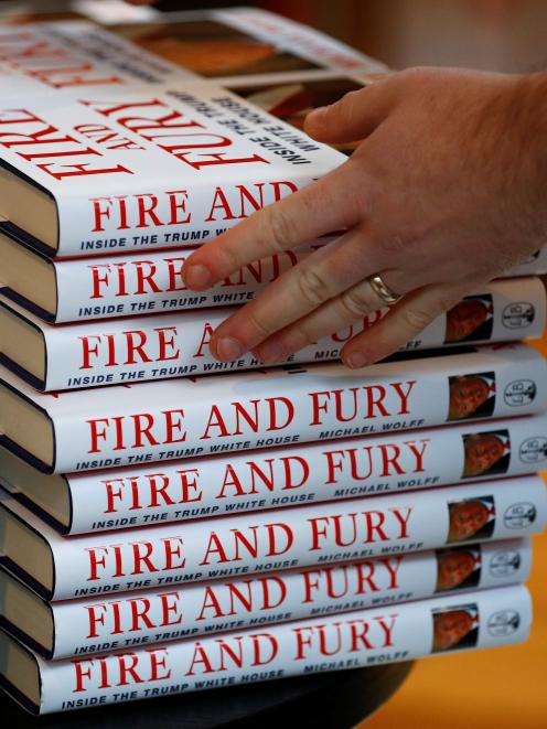 A shop worker arranges copies of Michael Wolff's book 'Fire And Fury'. Photo: Reuters