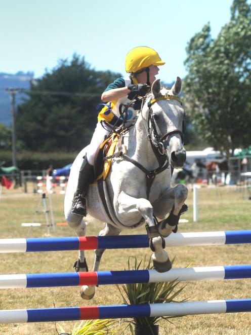 Kyla Garmonsway (13) looks for the next jump to take on her horse, Southwind Summer Rose. They were representing the Clyde Pony Club at the South Island Pony Club Showjumping Championships at the Taieri A&amp;P Showgrounds yesterday. Photo: Christine O'Connor