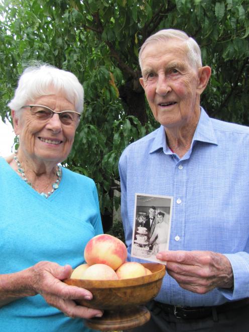Alexandra couple Shirley and Jack Alabaster celebrate their 65th wedding anniversary flanked by a...