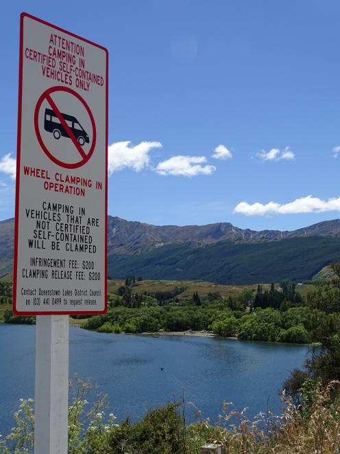 Before summer, Queenstown Lakes District Council installed gates and fencing around popular hotspots including Lake Hayes in an effort to control the practice. Photo: Tracey Roxburgh 