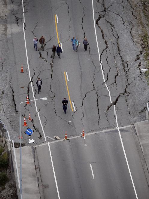 People walking over the South Brighton bridge after Christchurch was hit by a 6.3 magnitude earthquake. Photo: Sarah Ivey