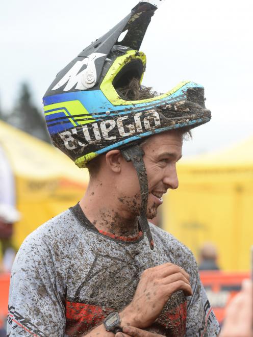 New Oceania downhill mountain bike champion Sam Blenkinsop has a smile of satisfaction after...