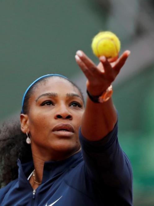 Serena Williams prepares to serve against Magdalena Rybarikova.  Photo Reuters