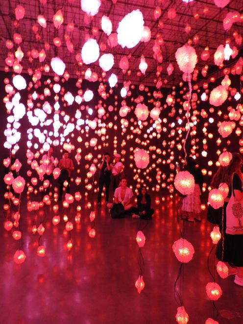 Visitors walk through ‘‘pixels’’ in Pipilotti Rist’s exhibition Sip my Ocean at the Museum of...