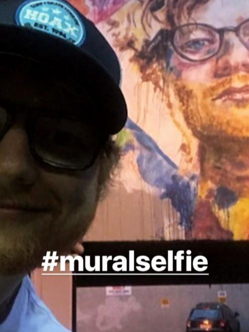 Ed Sheeran takes a selfie in front of the Bath St mural in Central Dunedin. Photo: Instagram