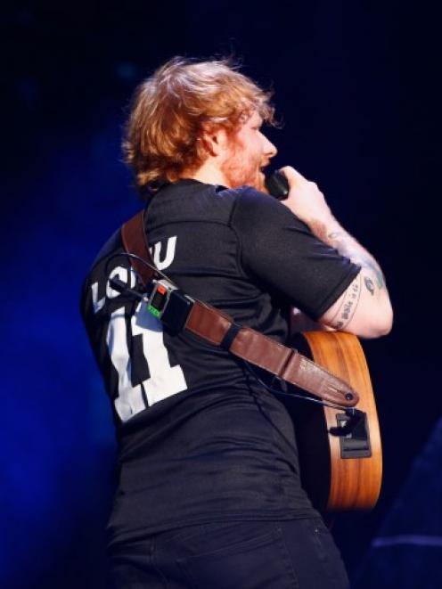 Ed Sheeran performs at Mt Smart Stadium last night. Photo: Getty