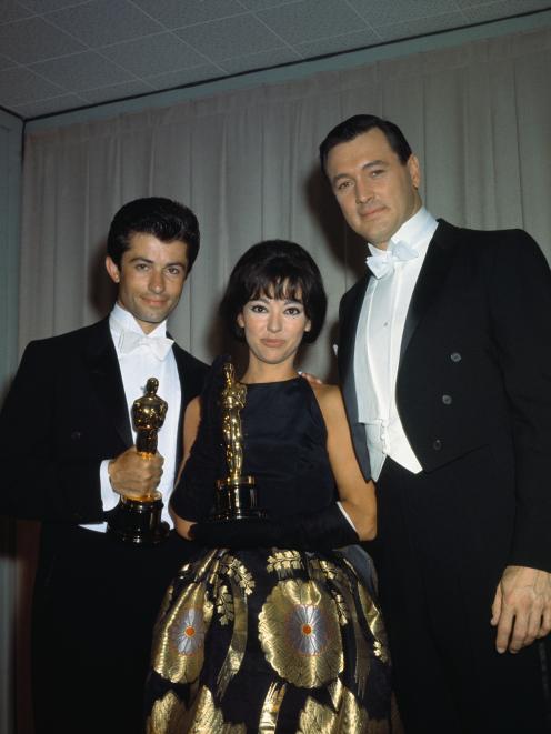 Rita Moreno wearing the dress in 1962 with fellow Oscar winner  George Chakiris  and Rock Hudson....