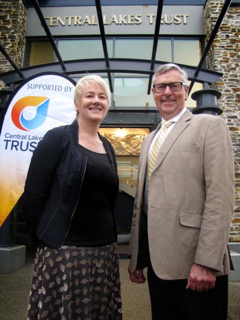 Central Lakes Trust chief executive Susan Finlay and chief executive Tony Hill display the trust's new logo outside the Cromwell CLT office. The trust is making an extra $3 million available for grants next financial year following a shift in direction an