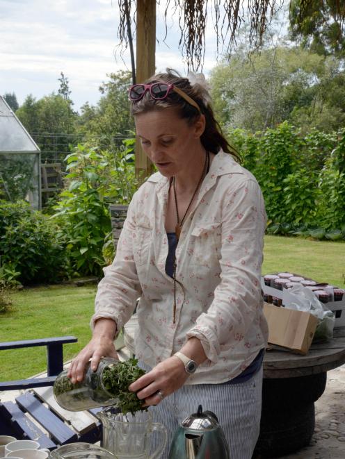 Bianca MacNeill prepares nettle tea at the Waitaki Community Gardens during hte "Eat your lawn"...
