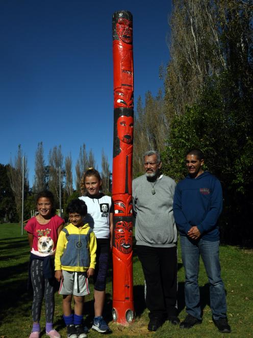 Pine Hill School board of trustees member Michael Prasad (second right) with Dunedin carver...