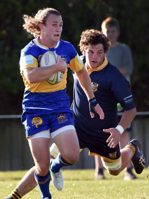 Taieri fullback Mitchell Scott takes off with Dunedin’s Jamie Mowat in pursuit during a premier...