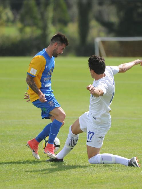 Southern United midfielder Alex Ridsdale (left) and Hamilton Wanderers' Xavier Pratt compete for the ball at Sunnyvale on Saturday. Photo: Christine O'Connor