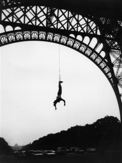 AJ Hackett bungy jumps off the Eiffel Tower in 1987. Photos supplied.
