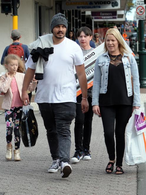 Shoppers stroll down George St with full bags as a four-day weekend winds down yesterday. Photo:...