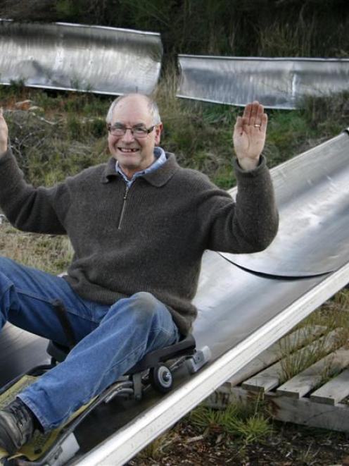 Naseby Summer Luge Trust member Eric Swinbourn takes a test run down part of the proposed summer...