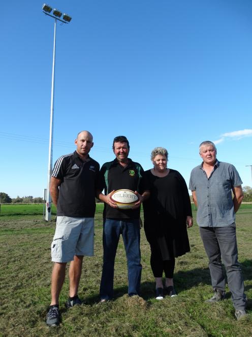 Maheno Rugby Club president Michael Hore (left), club supporters Marty McAtamney and Sally-Ann...