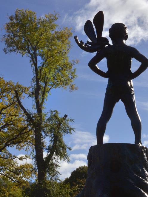 Peter Pan and Tinker Bell look on as Delta Trees arborist Dominic Ritter begins to fell a large...