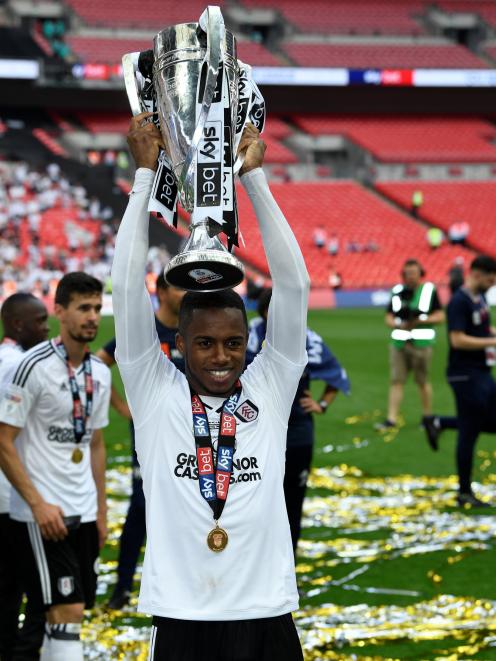 Fulham's teenage sensation Ryan Sessegnon lifts the trophy just days after his 18th birthday....