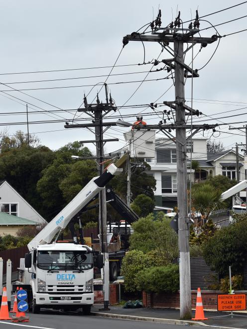 Network maintenance is undertaken at the corner of Bayfield Rd and Arawa St, Dunedin, yesterday morning. Photo: Peter McIntosh