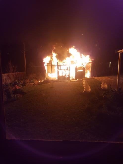 A garage at 18 Lewin St, Balclutha, shortly after emergency services were called about 12.30am this morning. Photo: Supplied A garage at 18 Lewin St, Balclutha, shortly after emergency services were called about 12.30am this morning. Photo: Supplied