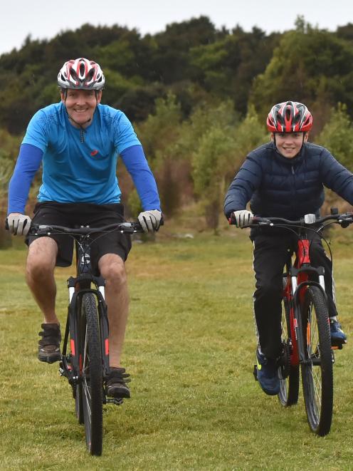 New to mountain biking, Stuart Davis and son Tom (11) try out the tracks at Signal Hill. Photos:...