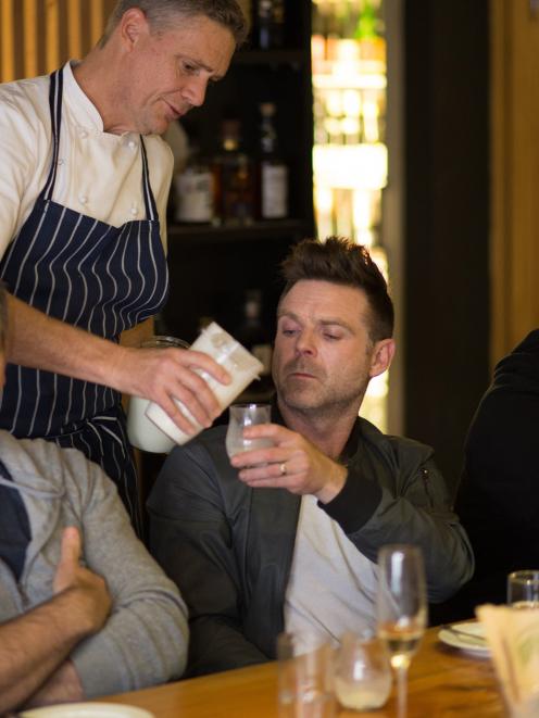 Geoff Scott serves chef Ben Bayly Pamu deer milk at a tasting event in Auckland. Photo: Lance...