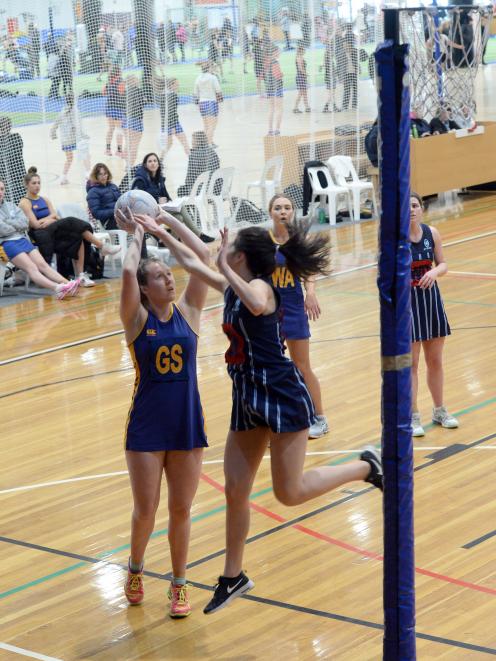 Phys Ed A goal shoot Sarah Boomer lines up a shot as St Hilda’s goal keep Anahera Reynolds...