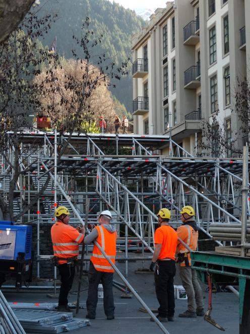 Contractors erect scaffolding on Brecon St yesterday in preparation for tonight's evening's Rail...