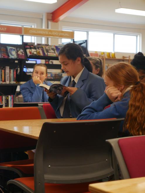 Queen’s High School pupil Payge Rakete-Gray (14) reads aloud a section of Rain Fall by Ella West. Photo: Jessica Wilson